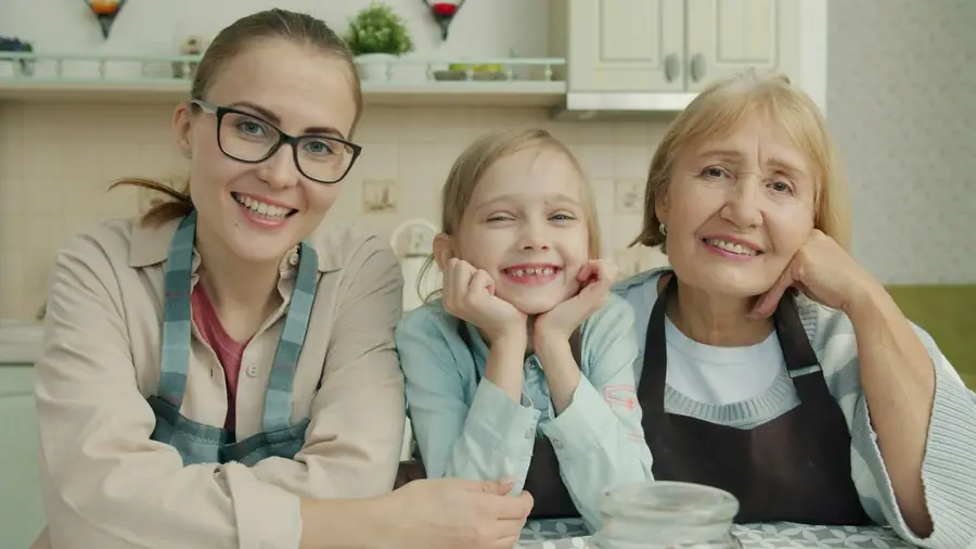 Three generations of women in a kitchen